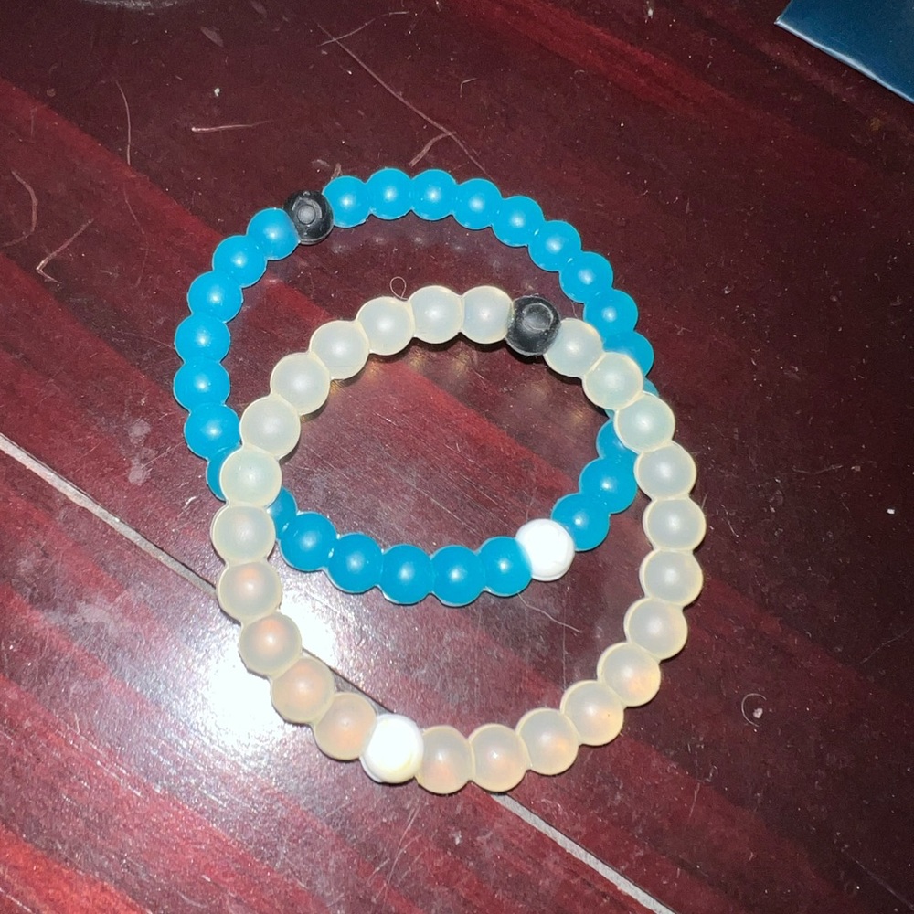 SOLD One white and one blue Lokai bracelets